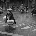 a woman transports potatoes in Vietnam