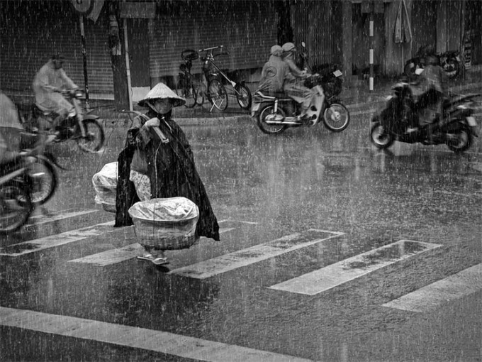 a woman transports potatoes in Vietnam