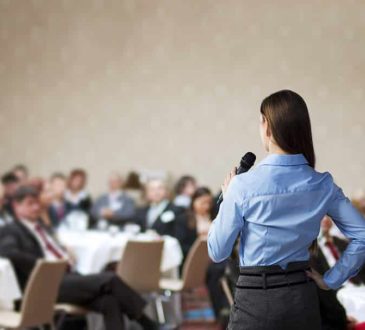 woman entrepreneurs speaking at conference