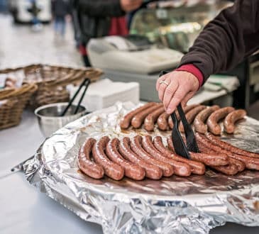 Grilling sausages for hot dogs