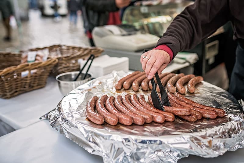 Grilling sausages for hot dogs