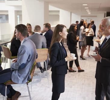 Delegates Networking At A Business Conference