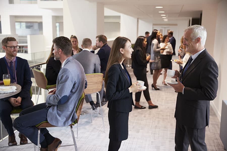 Delegates Networking At A Business Conference