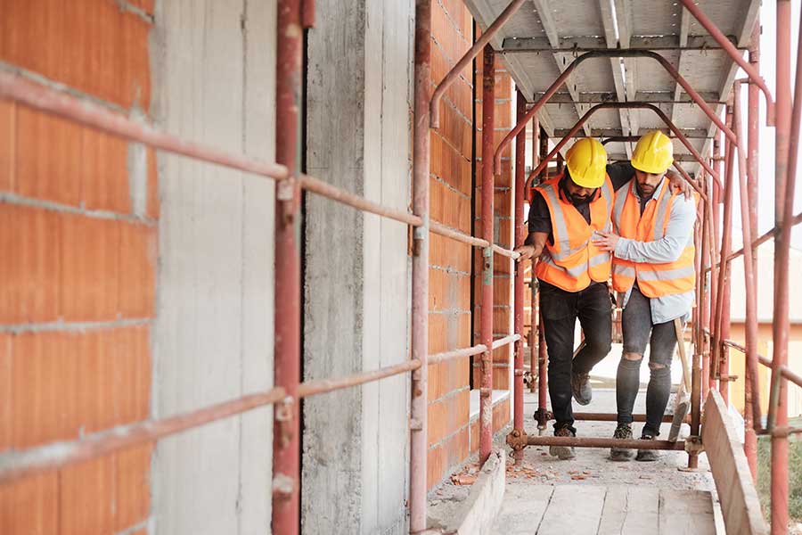 Worker Helping Injured Colleague