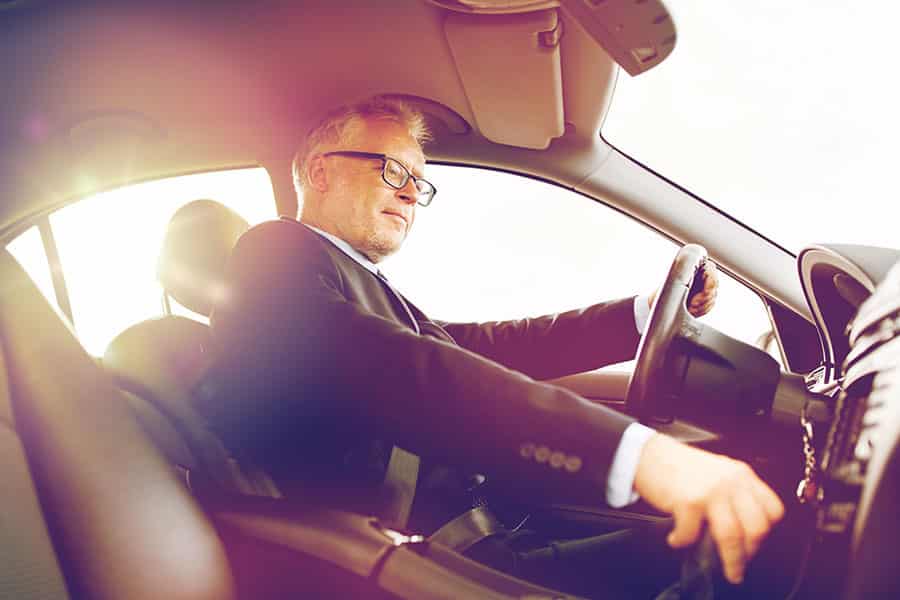 Businessman driving car