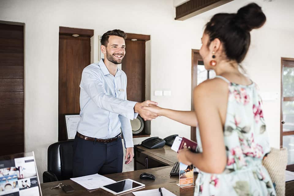 Guests checking in to a hotel