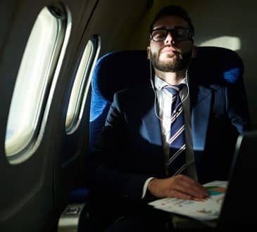 Businessman Sleeping in Flight