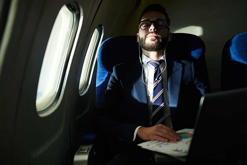 Businessman Sleeping in Flight