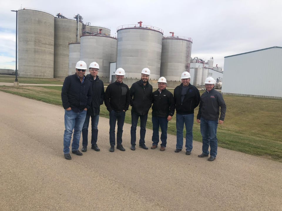 Yerkin Tatishev, center, Daniel Kunin, third from the left, and members of Kusto Group visit a farming operation in the United States