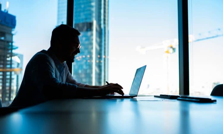 sitting at table desktop in office