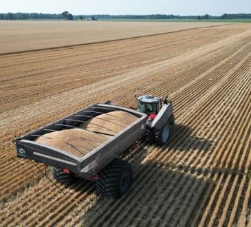 tractor towing a wheat cart