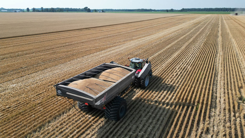 tractor towing a wheat cart