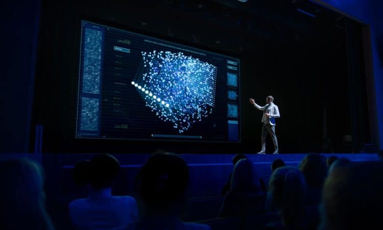 Computer Science Startup Conference: On Stage Speaker Does Presentation of New Product, Talks about Neural Networks, Shows New AI, Big Data and Machine Learning App on Big Screen. Live Event