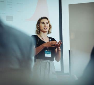 Woman entrepreneur discussing business ideas in a conference