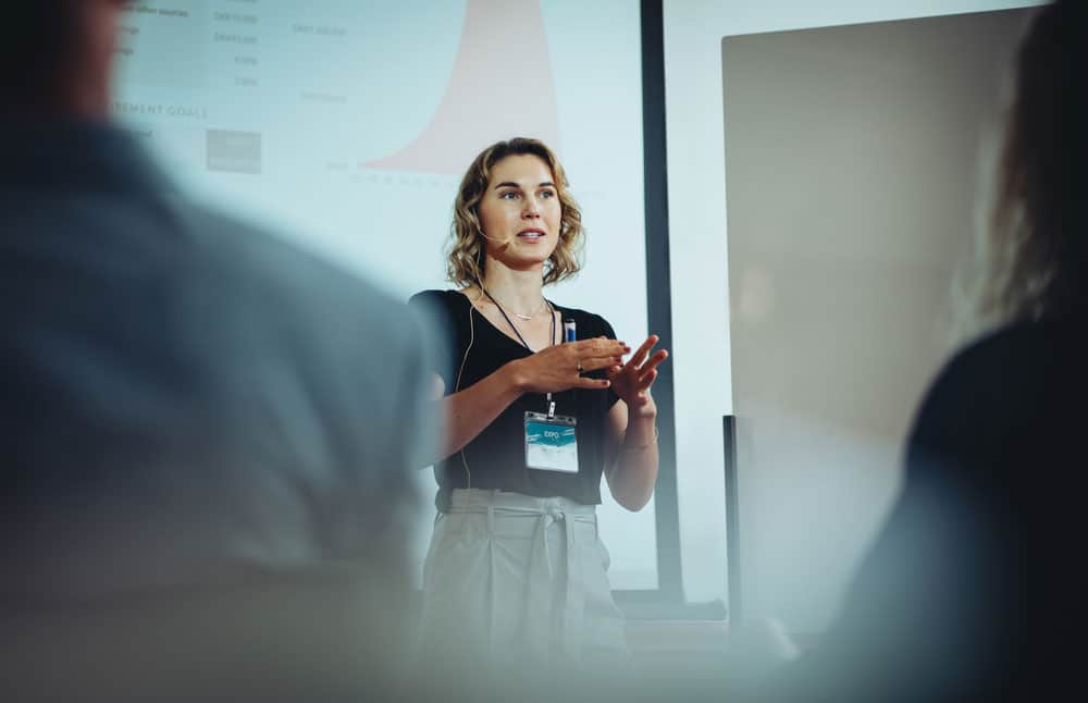 Woman entrepreneur discussing business ideas in a conference