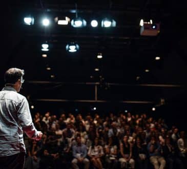 Speaker giving a talk on corporate Business Conference